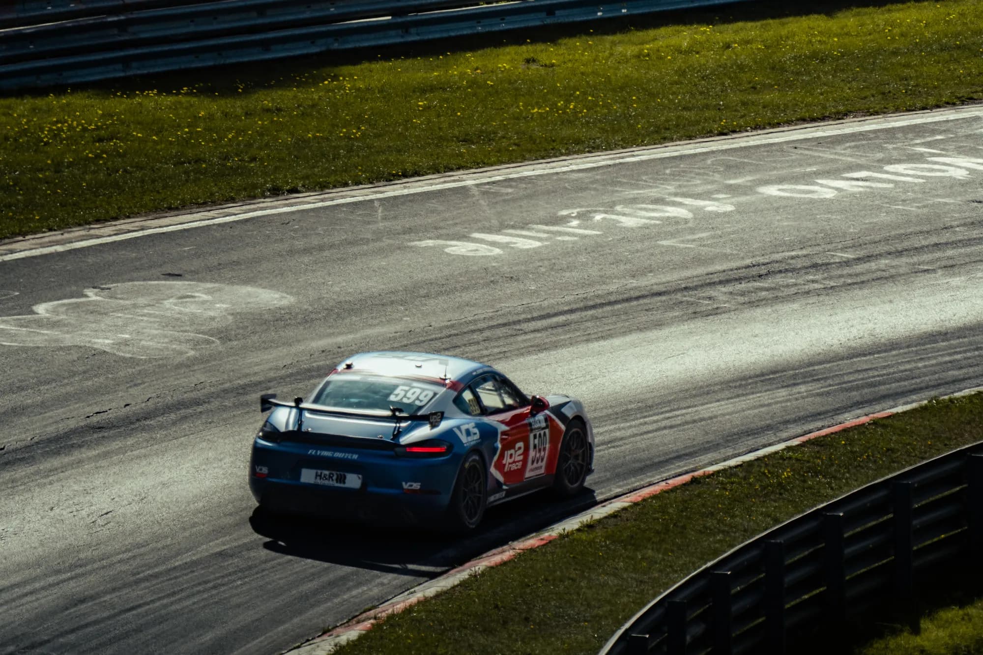 Porsche 718 Cayman GT4 Clubsport cornering on the Nordschleife